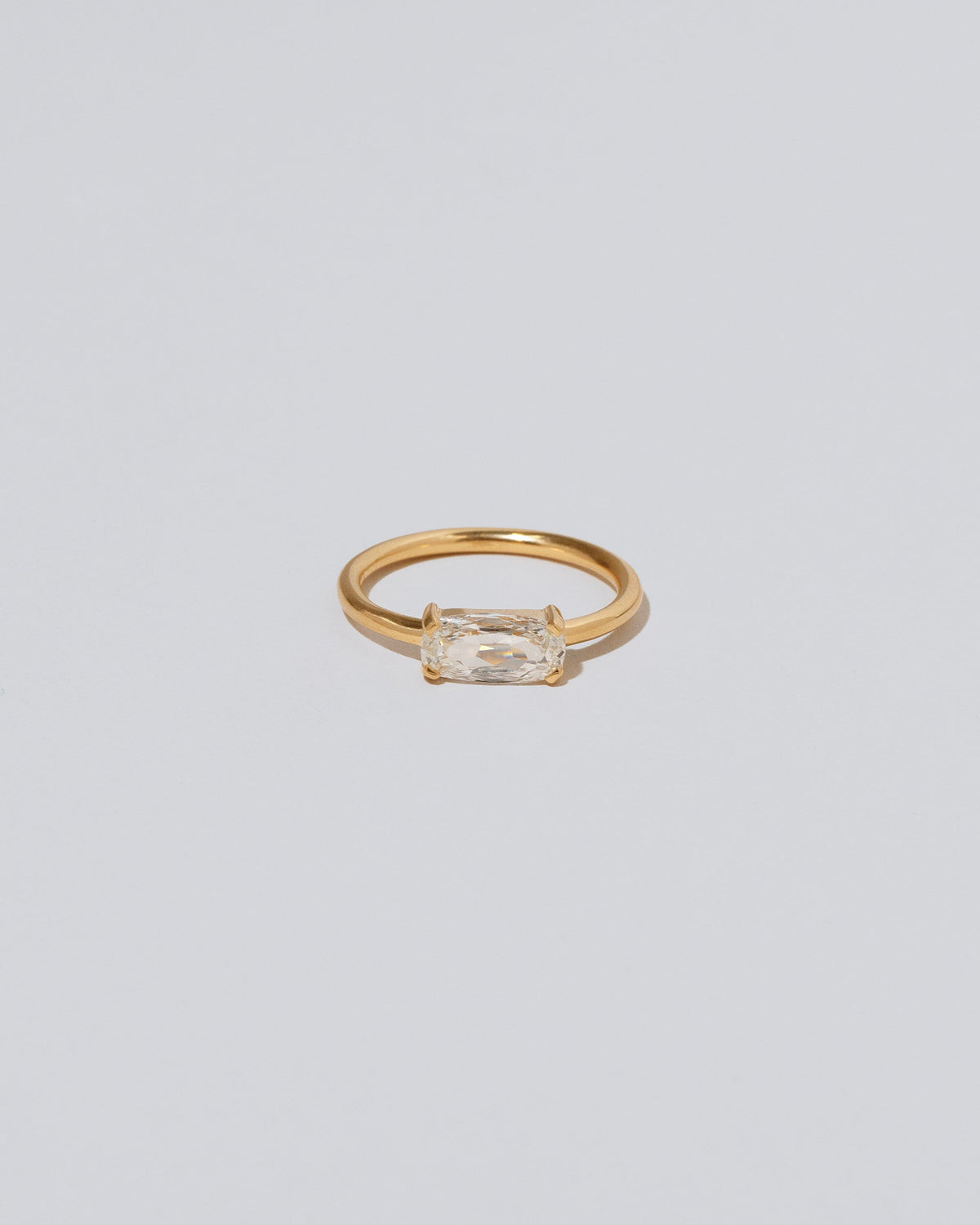 Adage Ring on light color background.