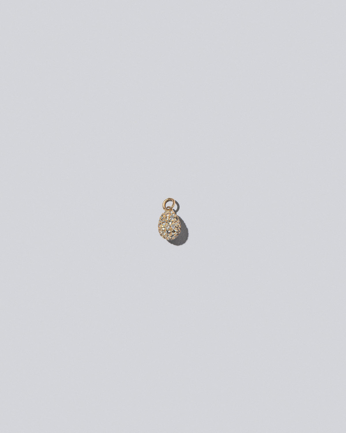 Diamond Pavé Egg Charm on light color background.
