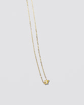  Be Good Necklace on light color background.