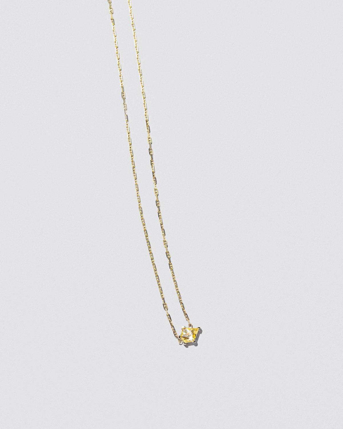  Be Good Necklace on light color background.