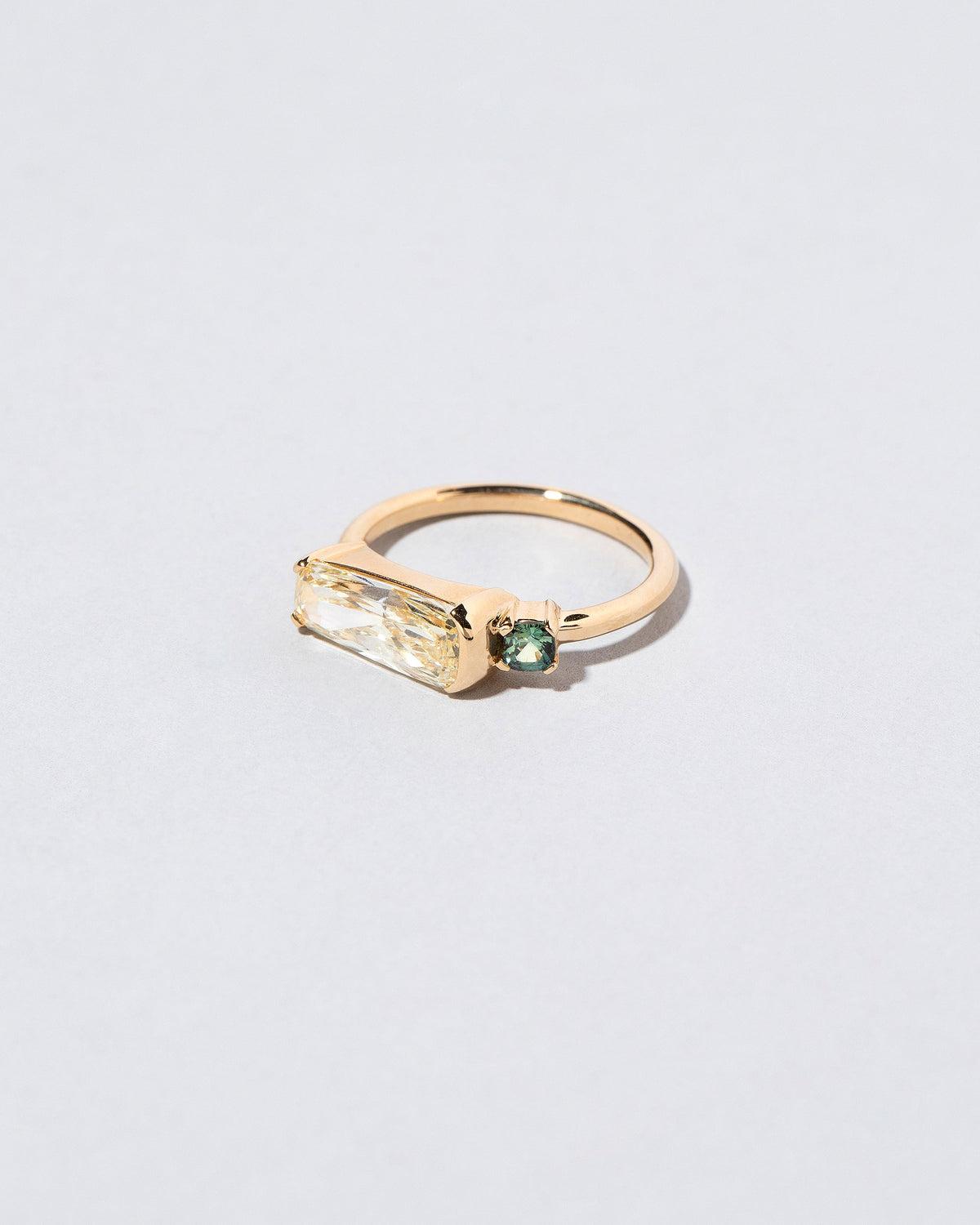  Immanence Ring on light color background.