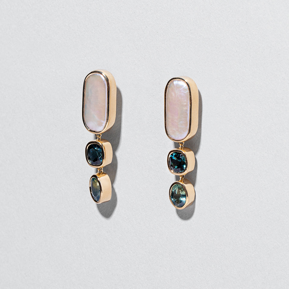 product_details:: Luster Earrings on light color background.