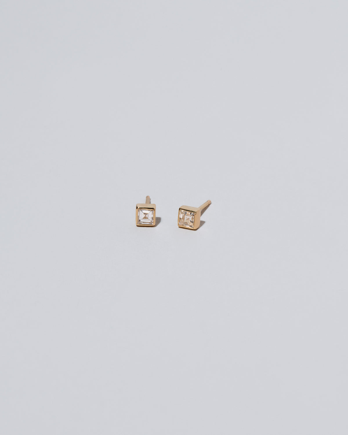 Square Stud - White Diamond on light color background.