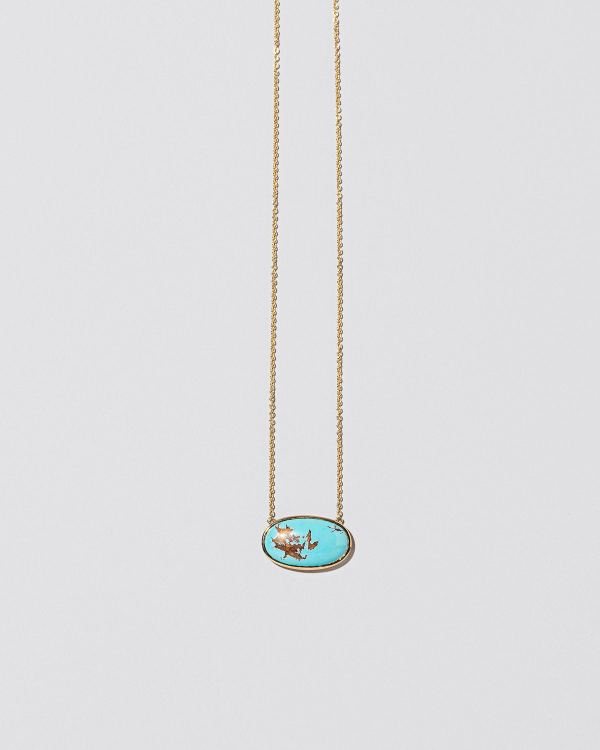 Tranquility Necklace on light color background.