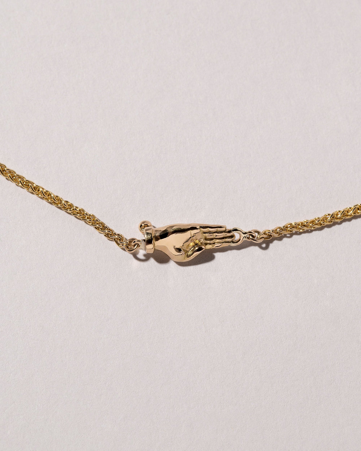 Manifestation Necklace on light color background.