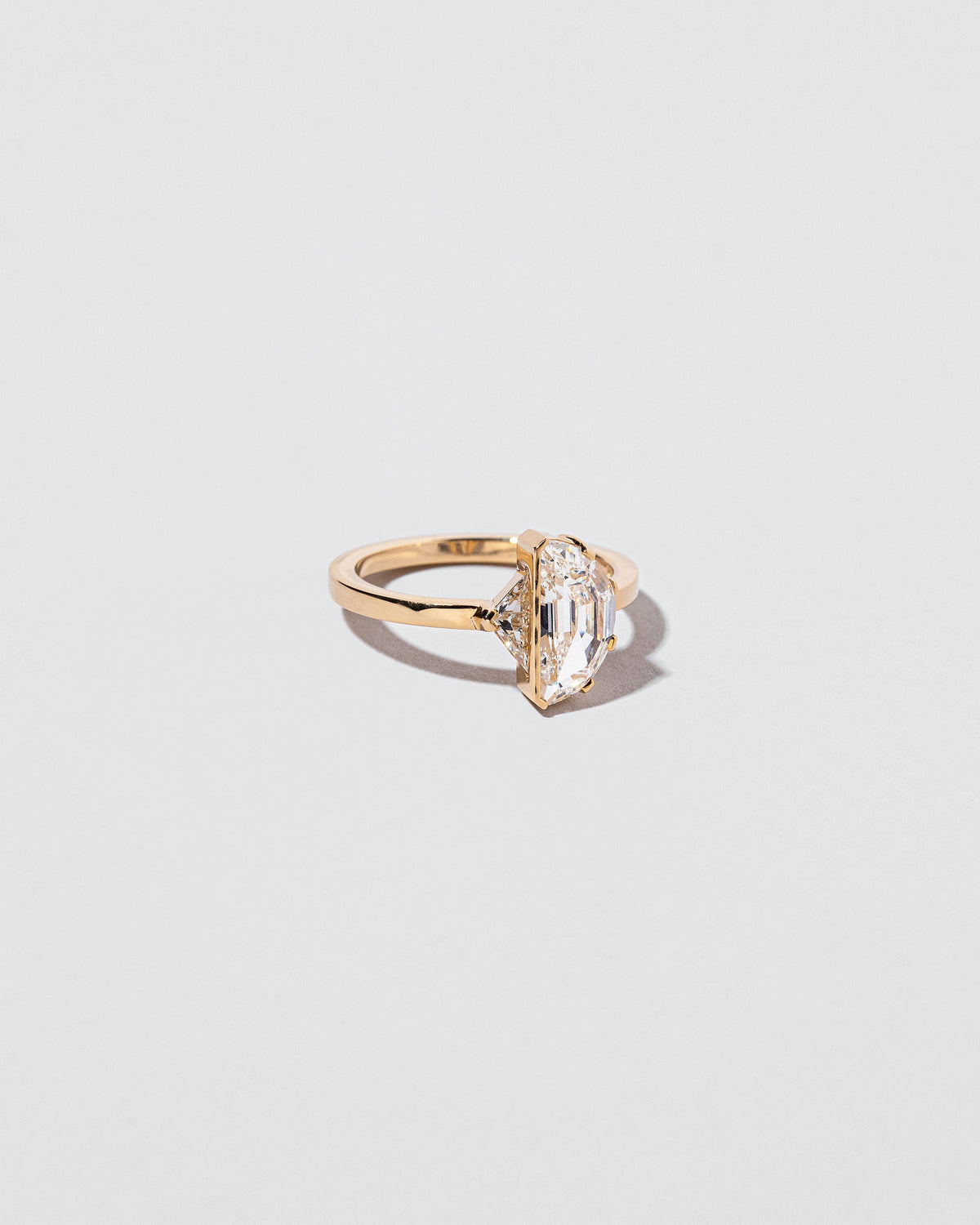  High & Low Ring on light color background.