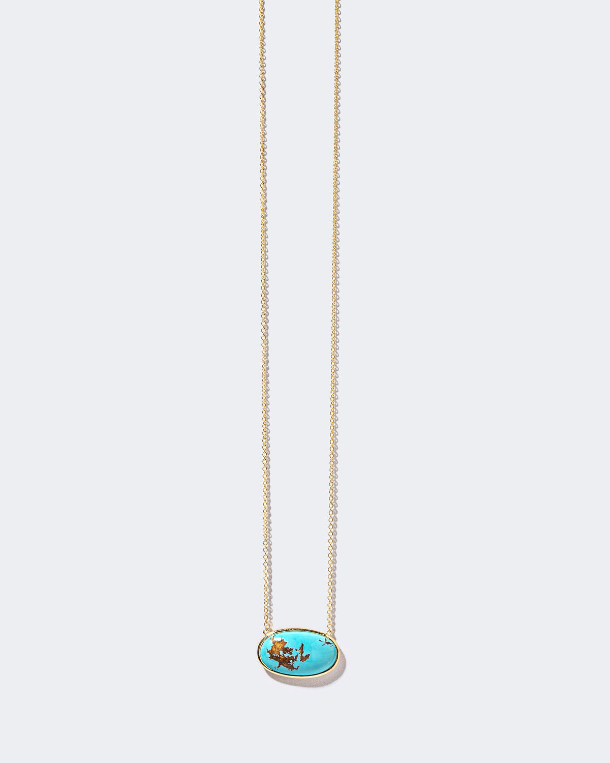 Tranquility Necklace on light color background.