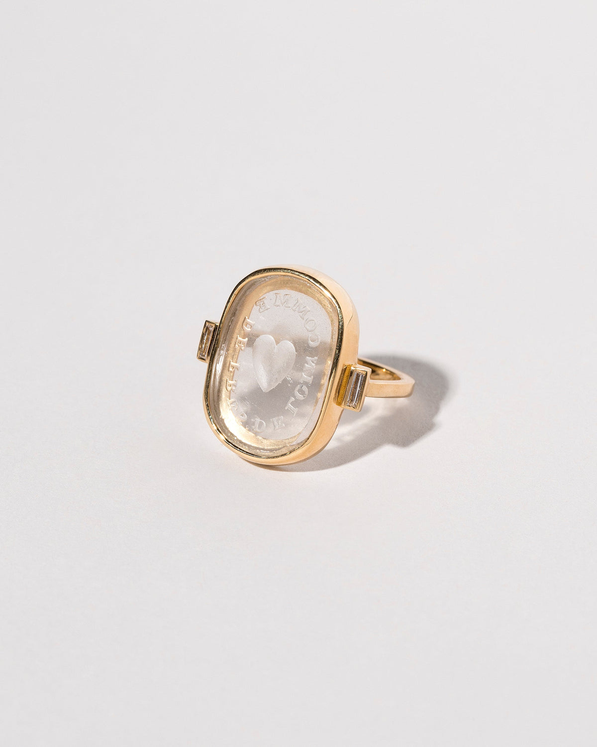 View from the side of the Long Distance Intaglio Seal Ring on light color background.