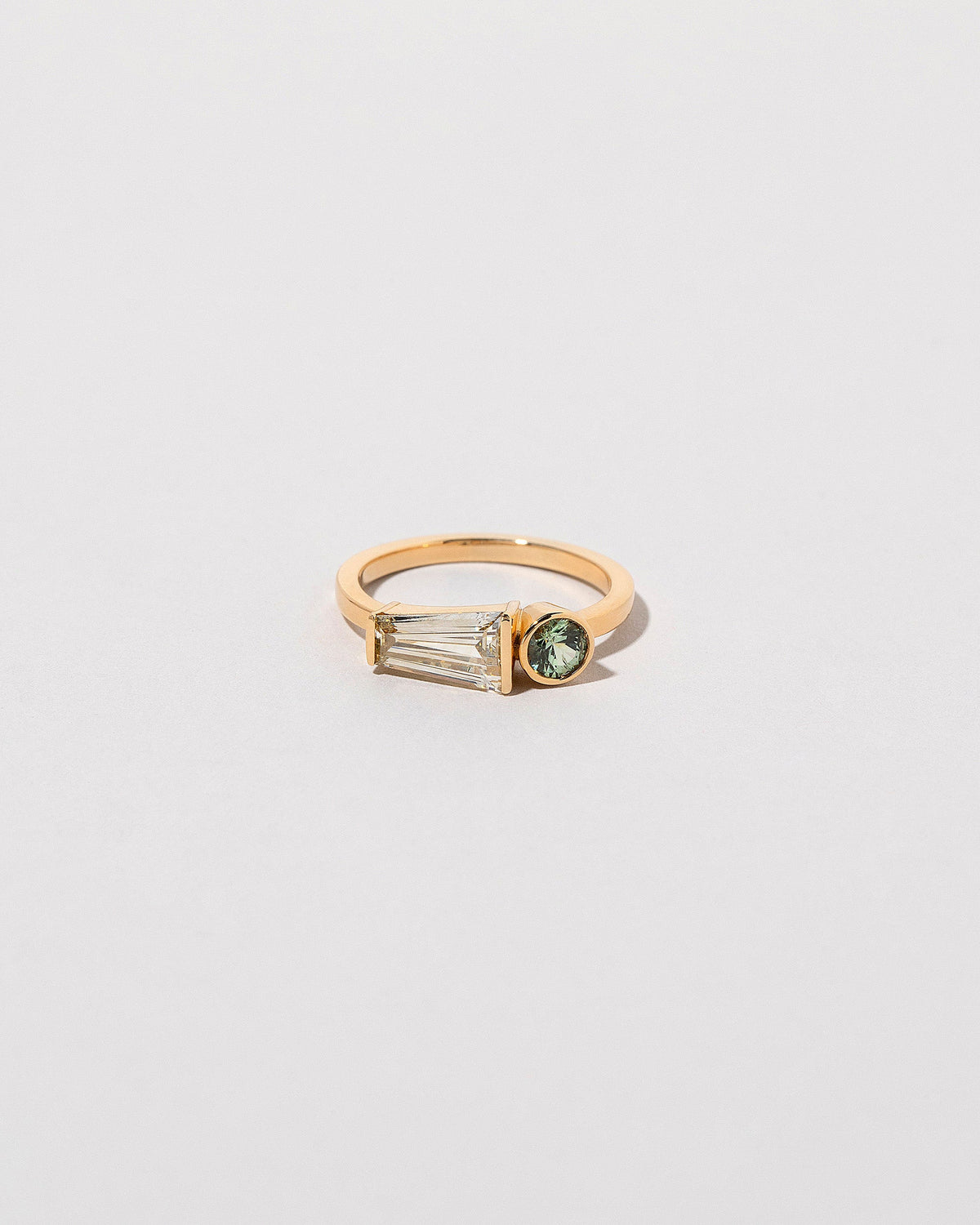  Merret Ring on light color background.