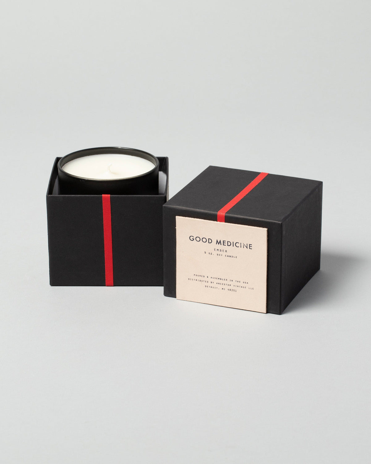 Good Medicine Ember Candle on light color background.