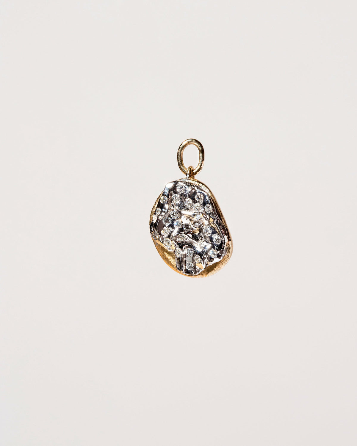Plain Bagel Charm with Diamond Cream Cheese on light color background.