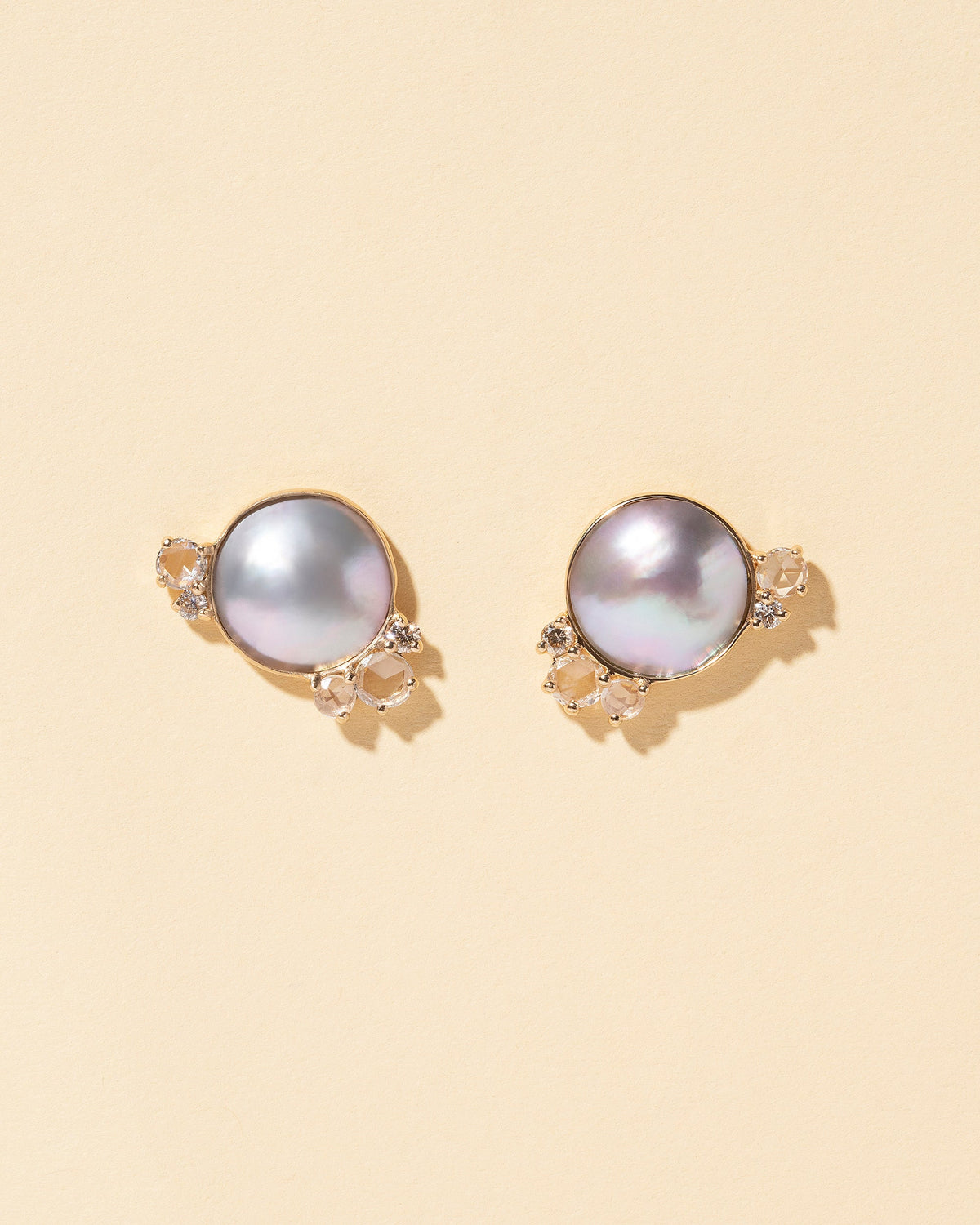  Mabe Pearl Cluster Earrings on light color background.
