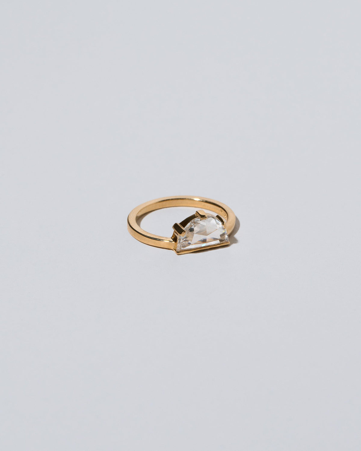 View from the side of the Plié Ring on light color background.