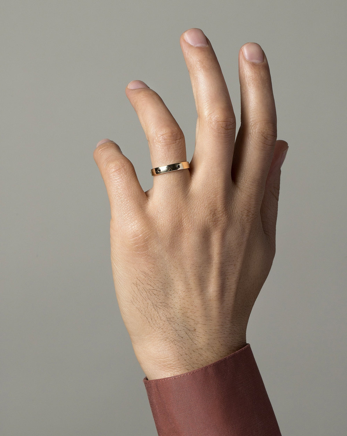 Gold with Six Stone Black Diamond 1.6mm 4mm Square Wire Band on male model.