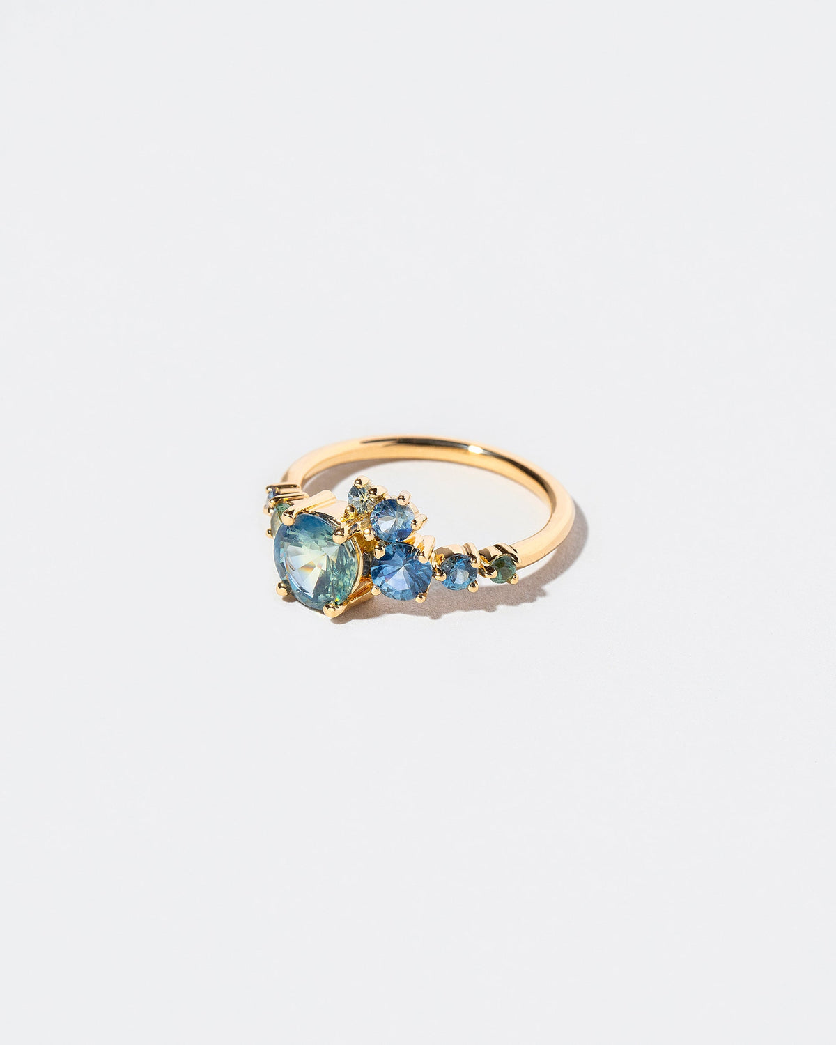  Luna Ring - Bicolor Sapphire on light color background.