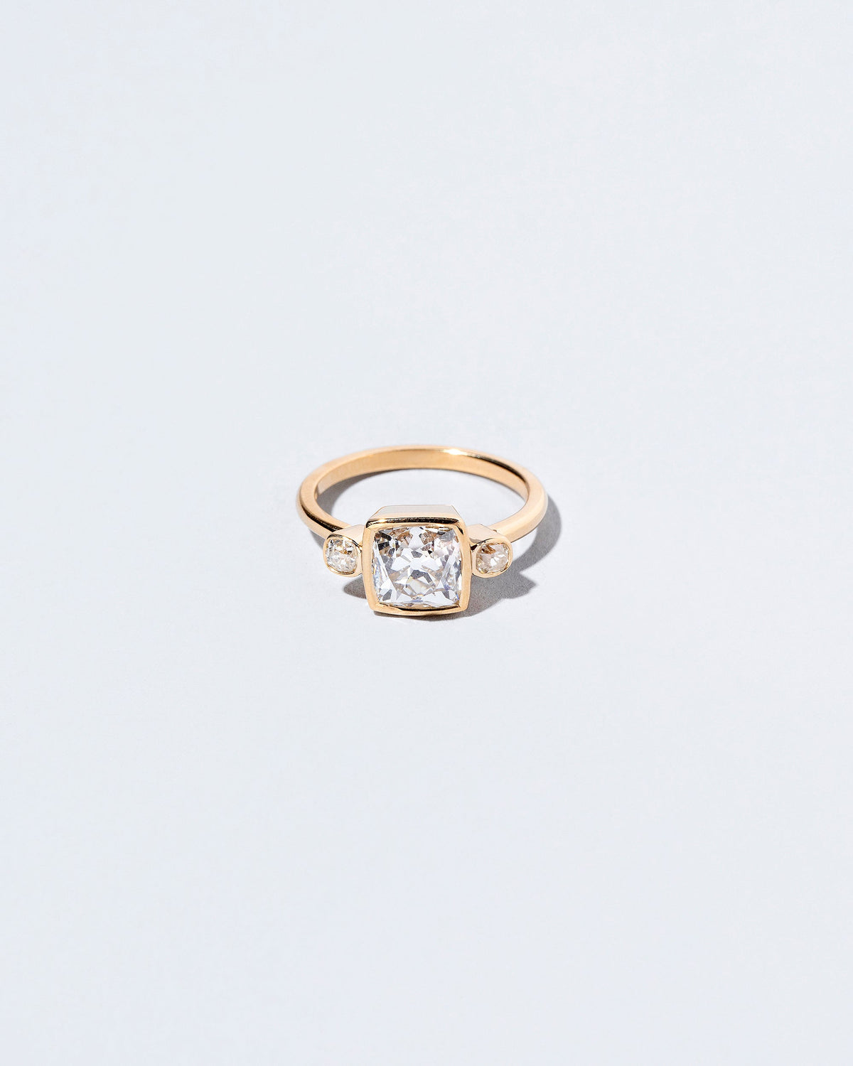  Genesis Ring on light color background.
