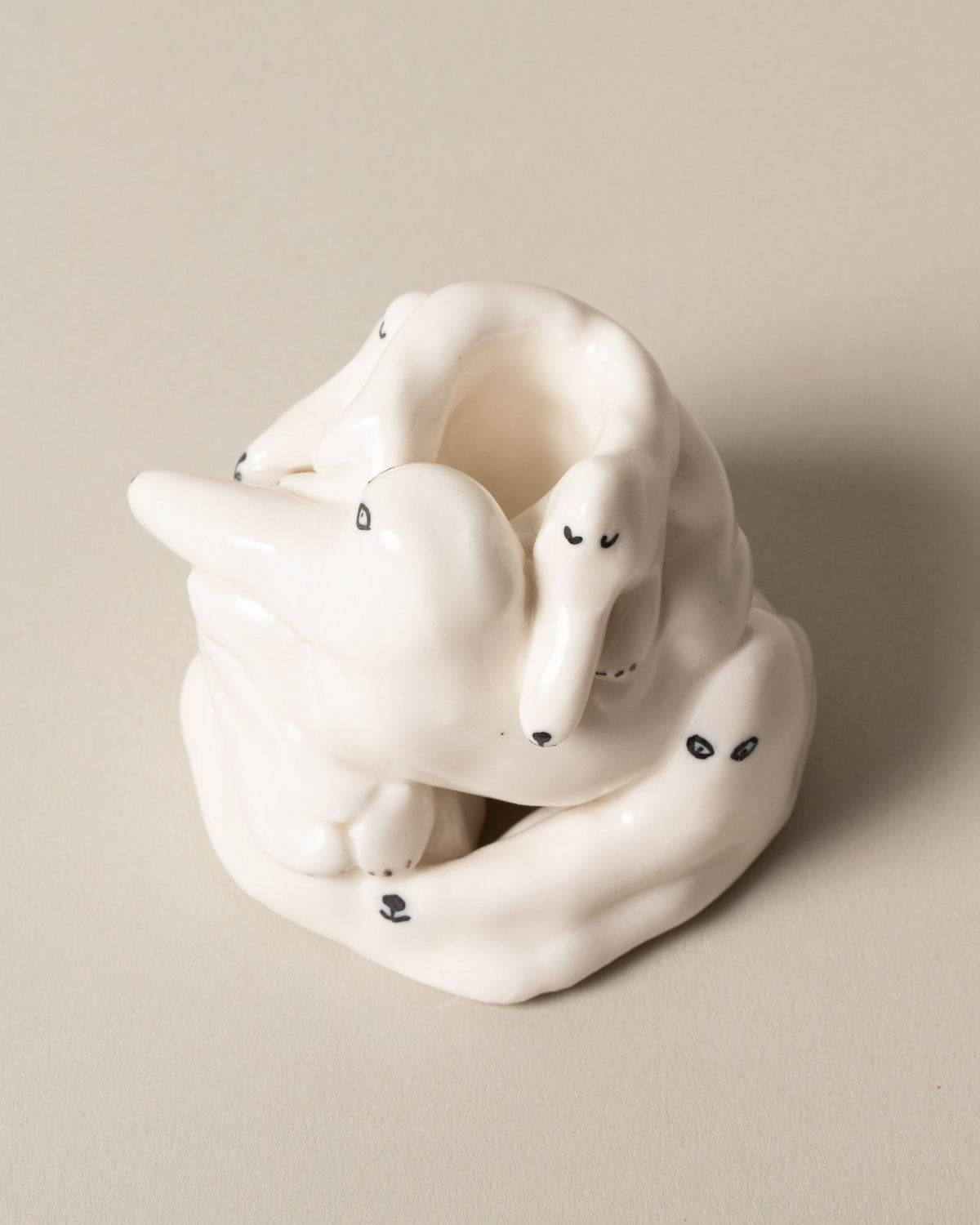 Closeup detail of the Eleonor Boström White Dog Pile on light color background.