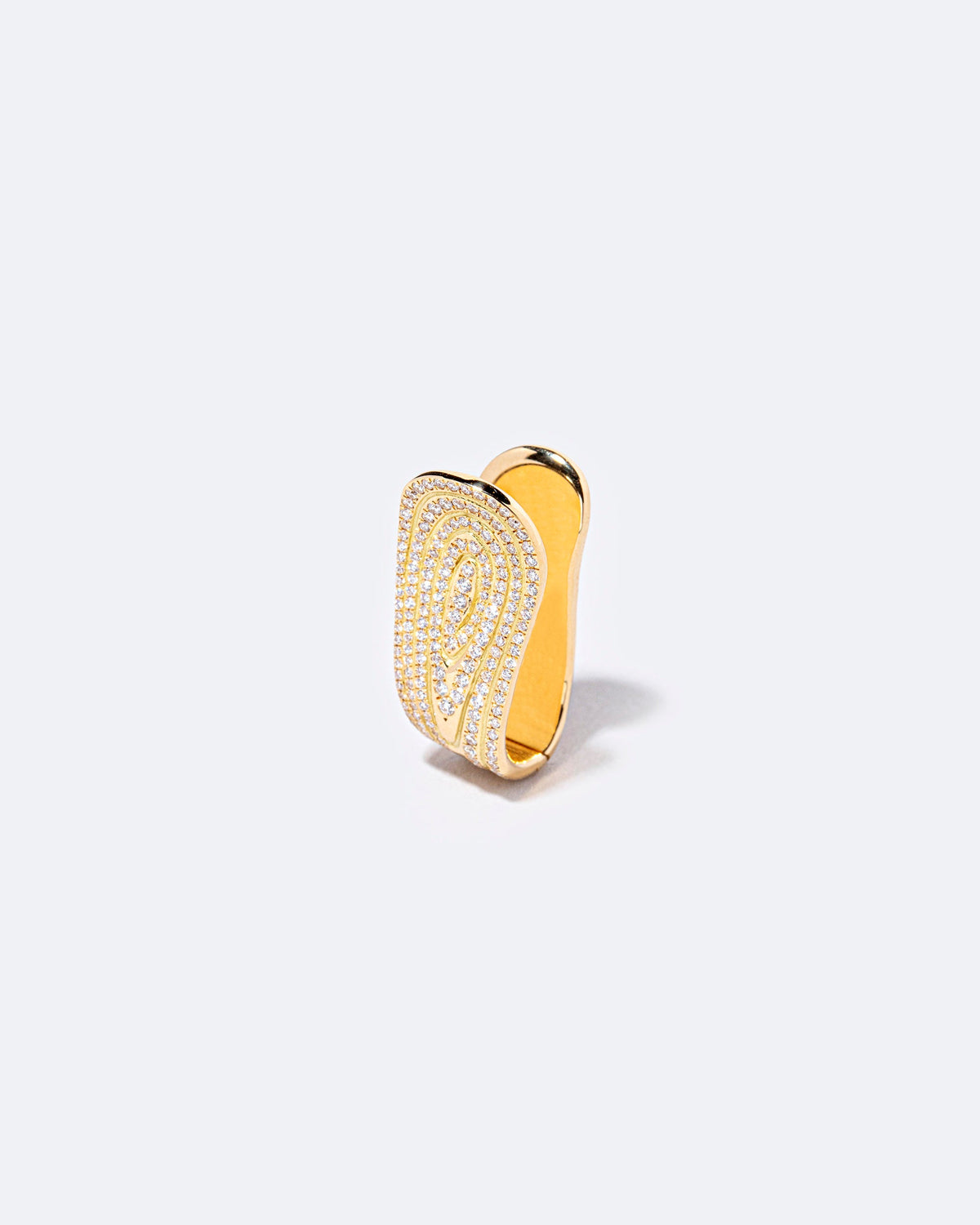 Closeup details of the White Diamond Duality Hoop Earring on light color background.