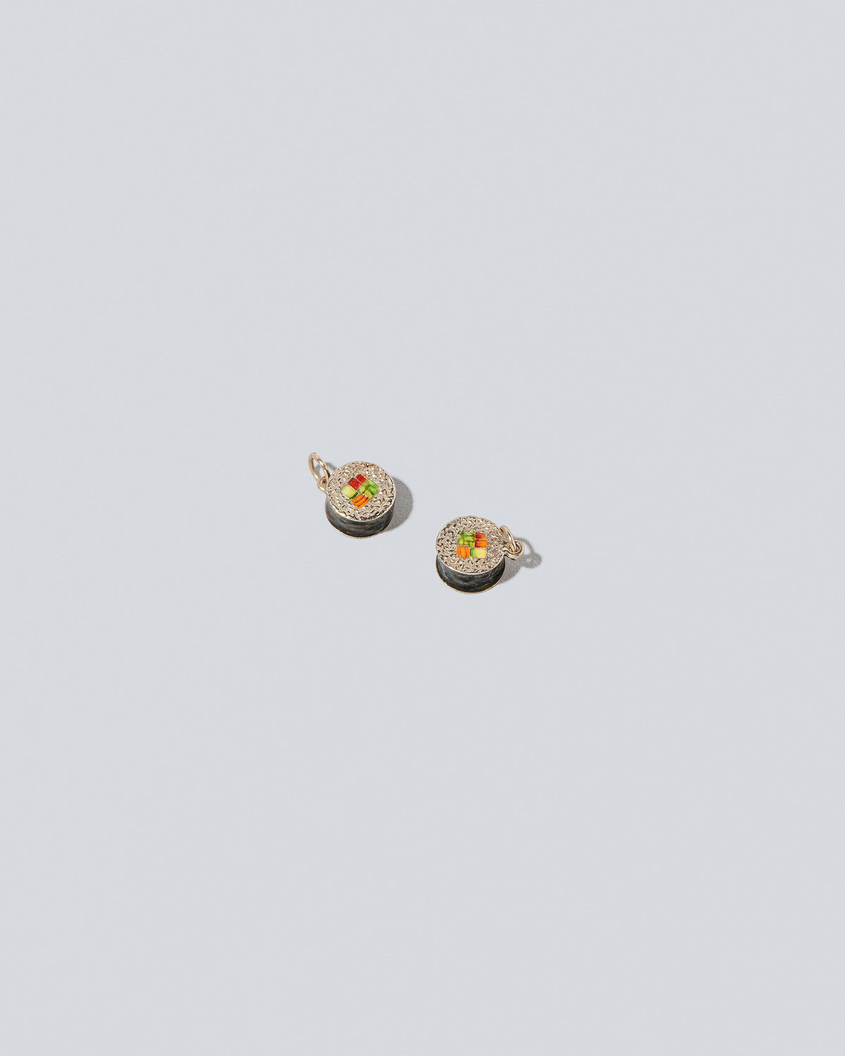 Sushi Charms on light color background.