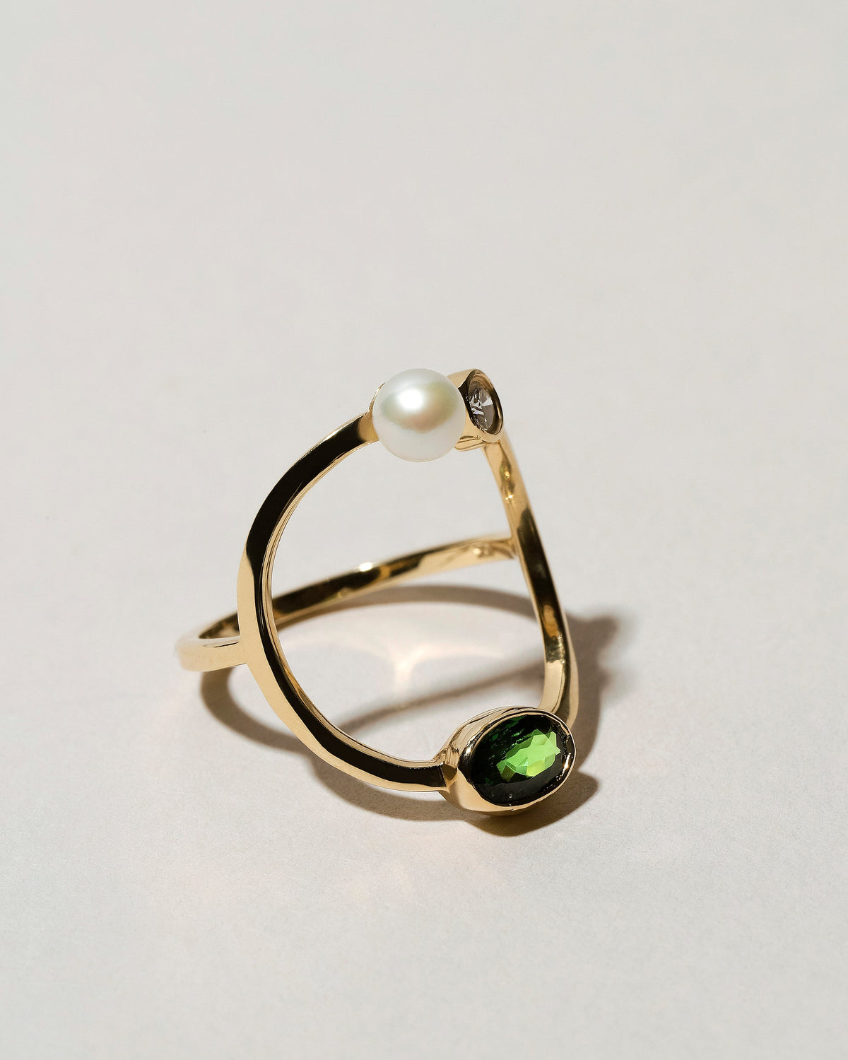  Trilogy Ring - Tsavorite on light color background.