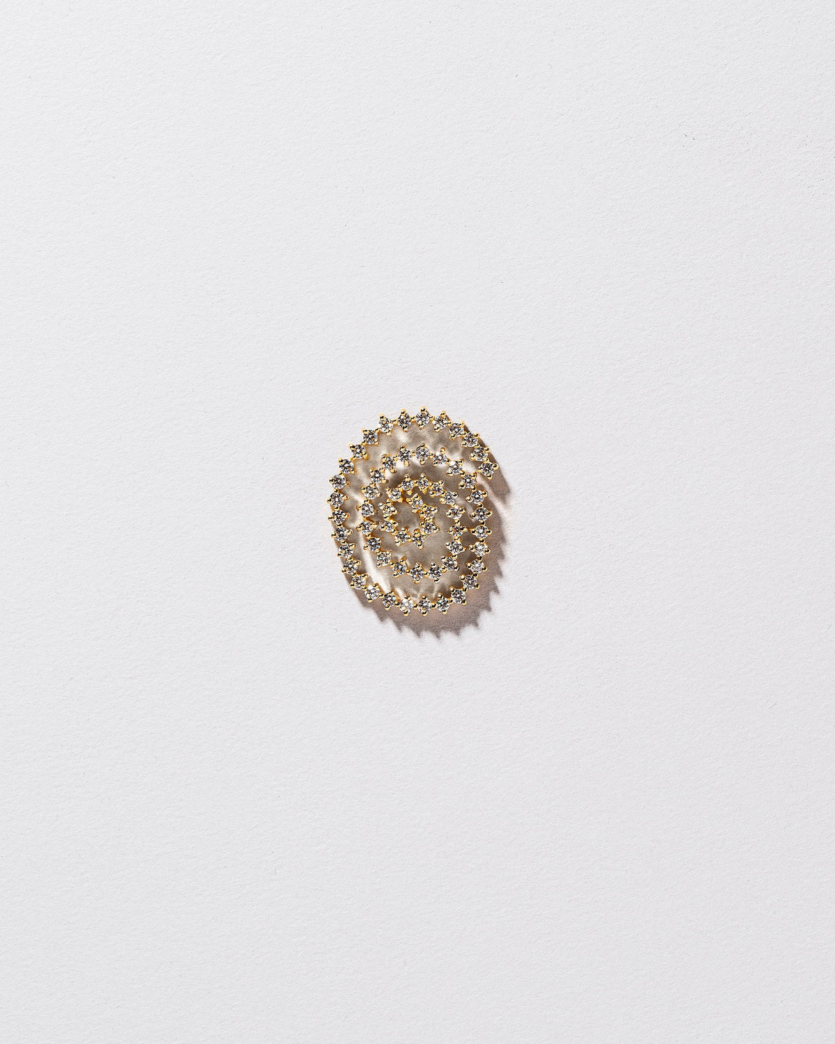 Right White Diamond Cycle of Rebirth Earring Single on light color background.