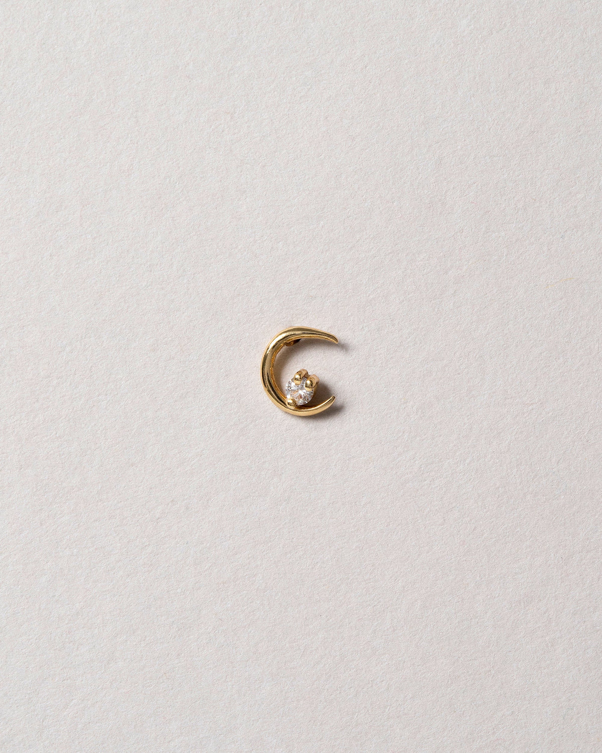 Right White Diamond Moon Ray Stud Earring Single on light color background.