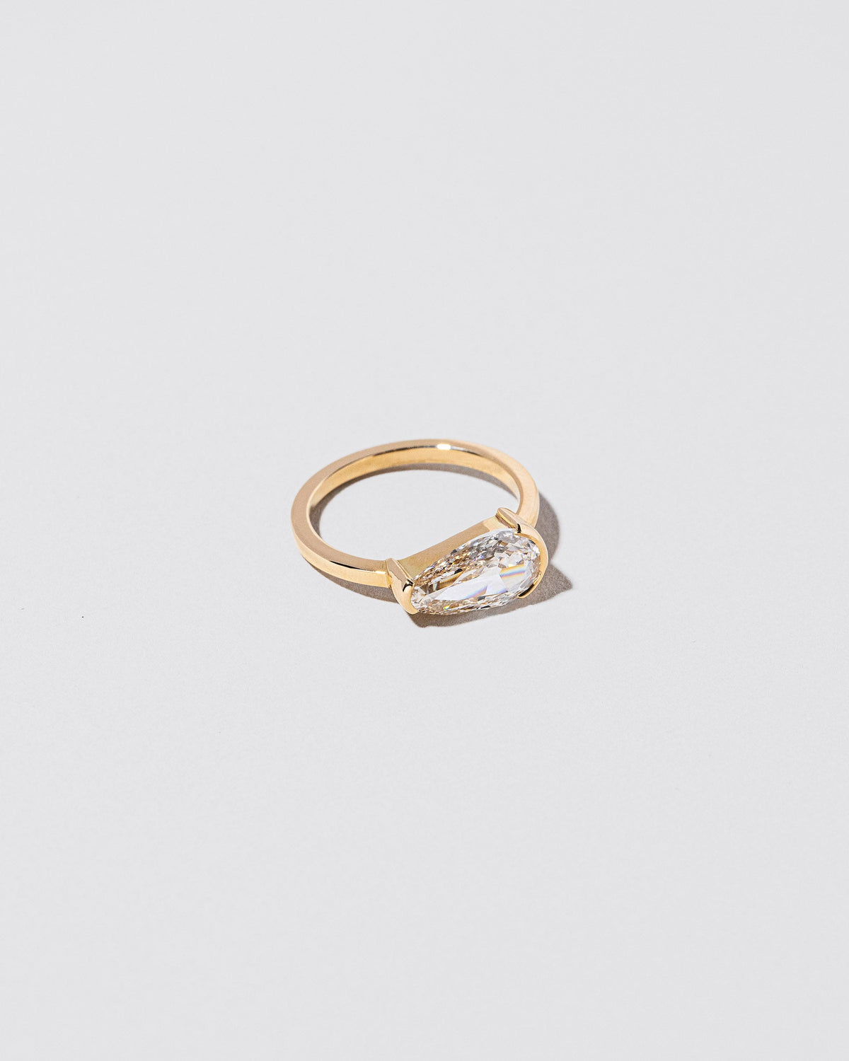 View from the side of the Divination Ring on light color background.