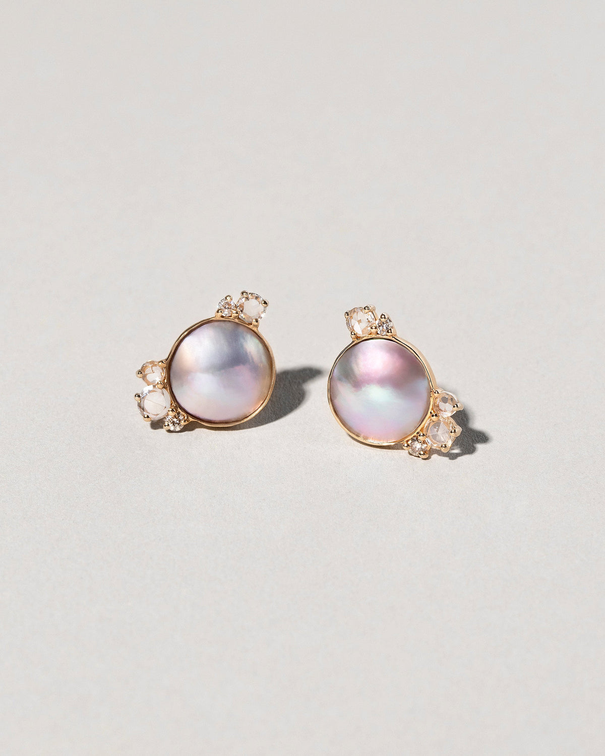  Mabe Pearl Cluster Earrings on light color background.