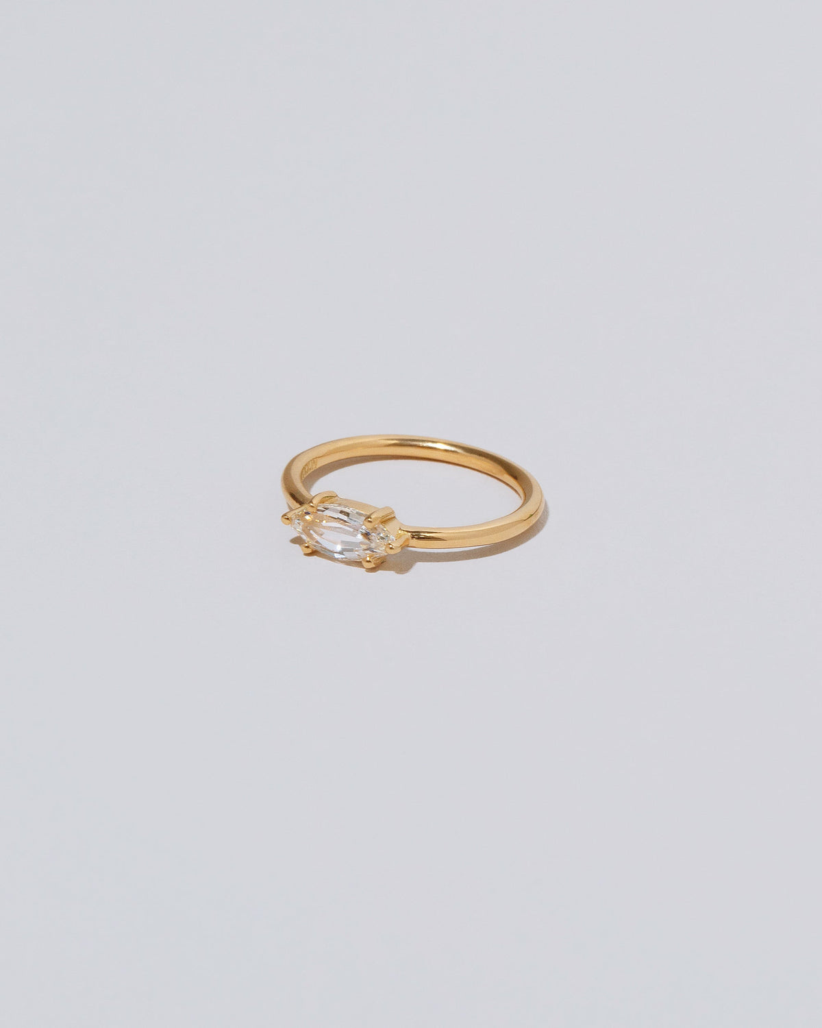 View from the side of the Ouvert Ring on light color background.