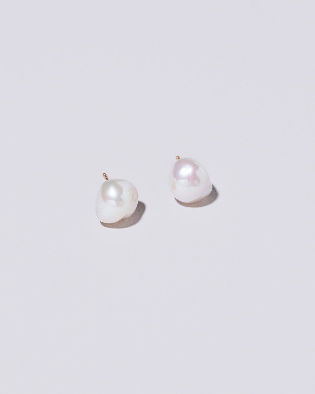  Lagniappe Pearl Stud Earrings on light color background.