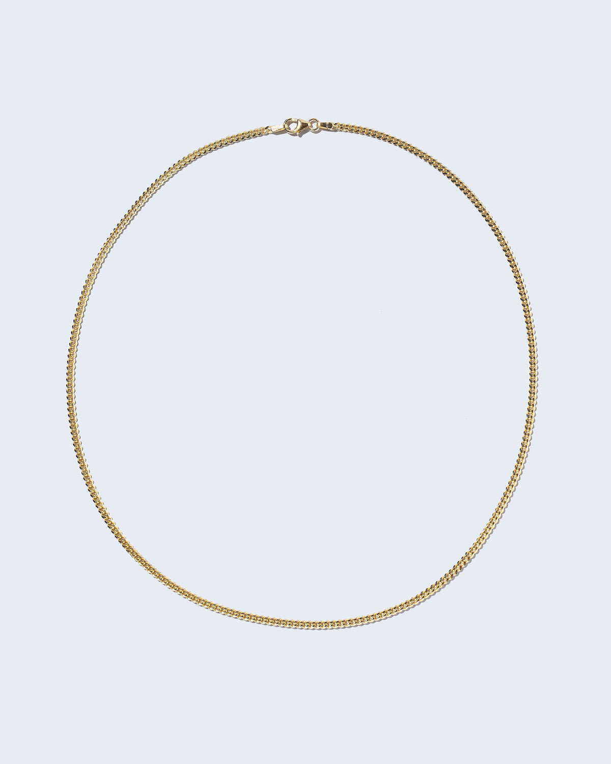 2.4mm Curb Chain Necklace on light color background.