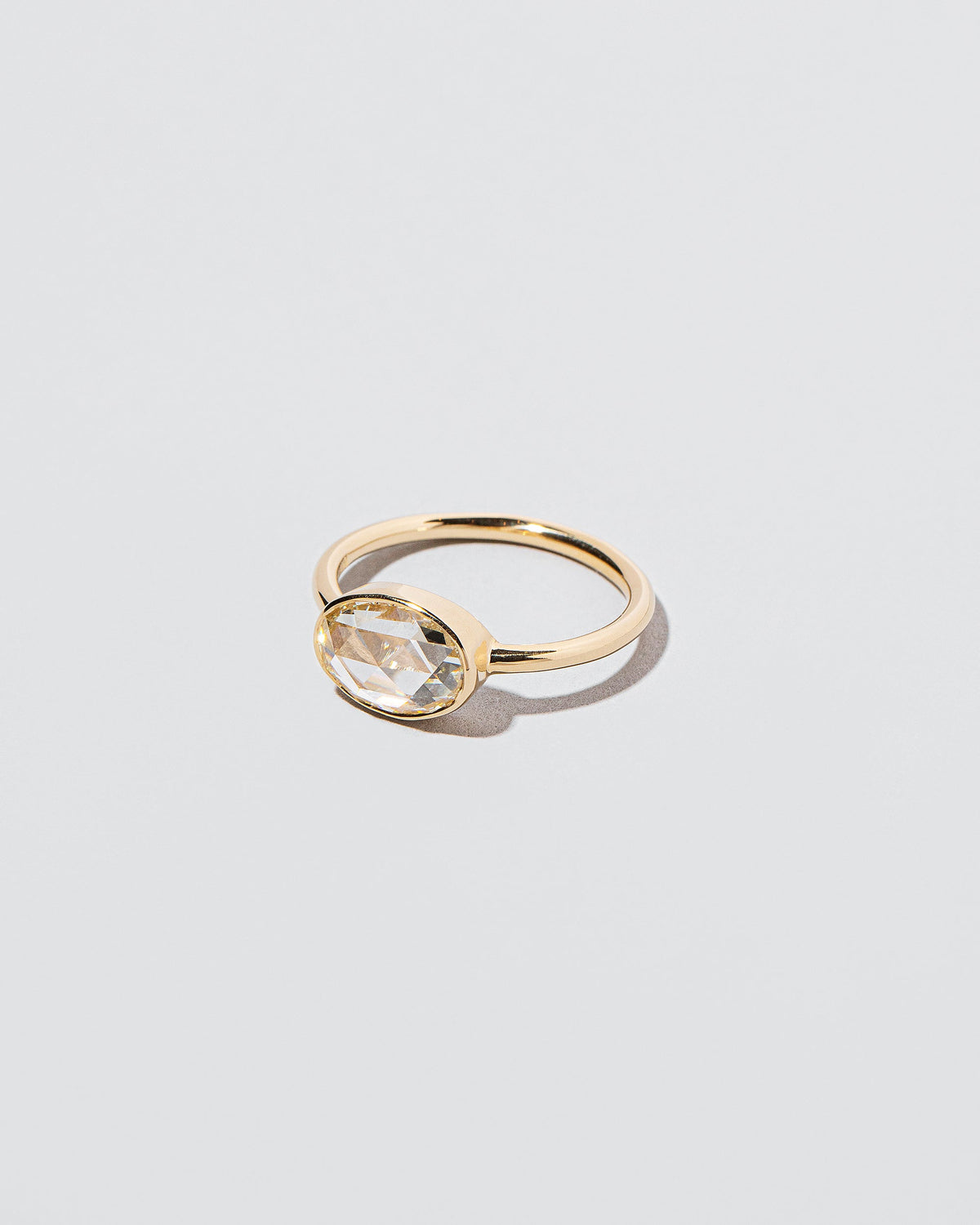 View from the side of the Ellipse Ring on light color background.