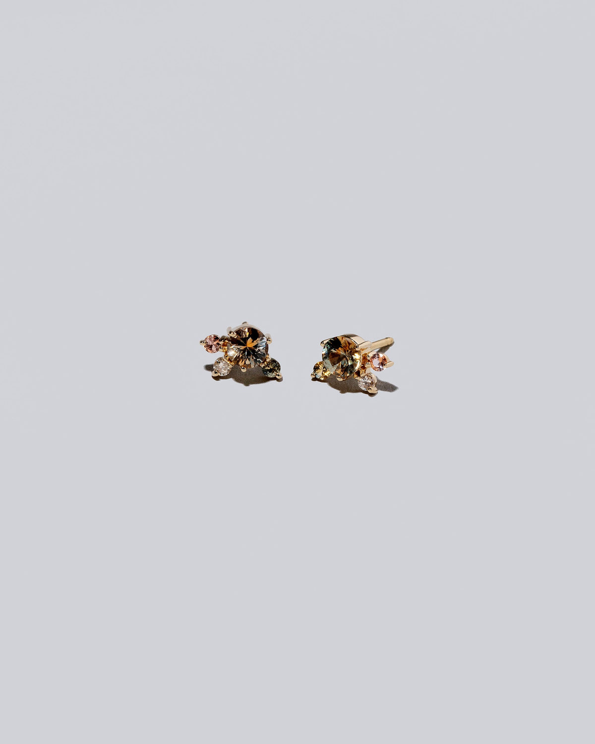 Product photo of Cluster Stud Earrings on a light color background.