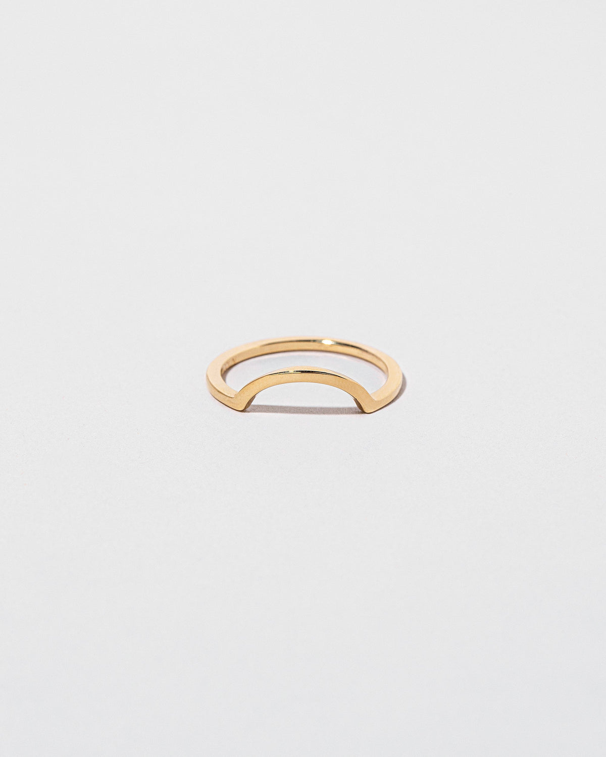 Gold Square Wire Curve Band on light color background.