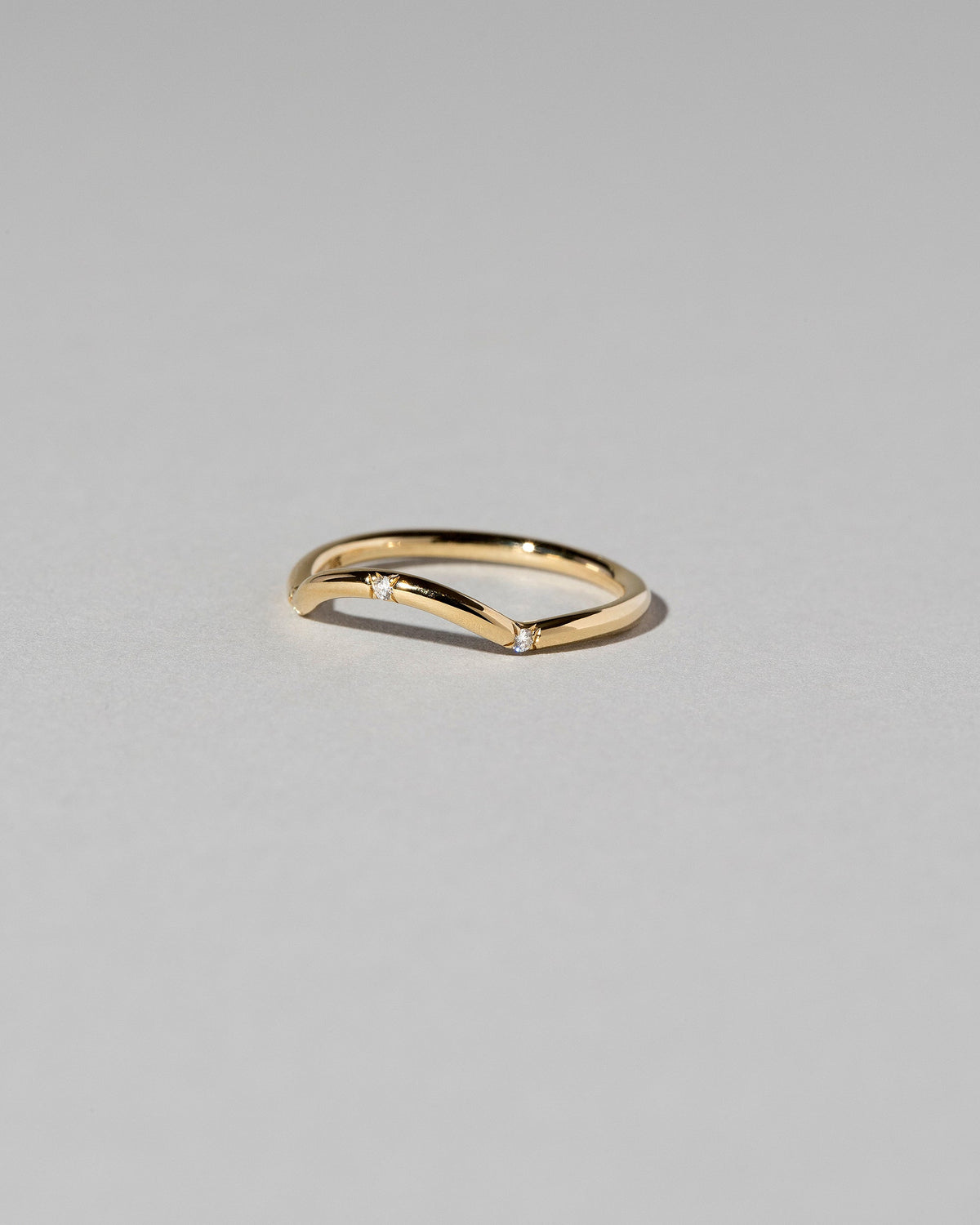  Mini Curve Band - Three Stone on light color background.