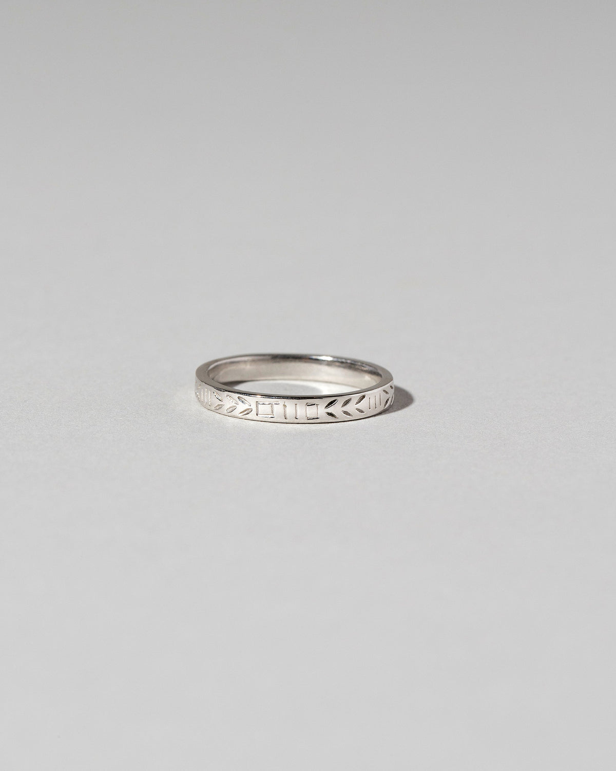 Platinum Etched Infinity Pattern Band on light color background.