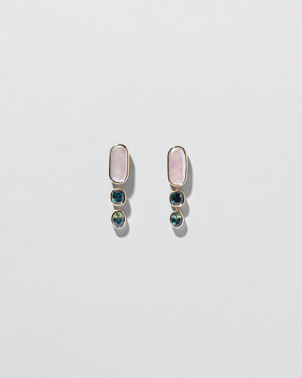  Luster Earrings on light color background.