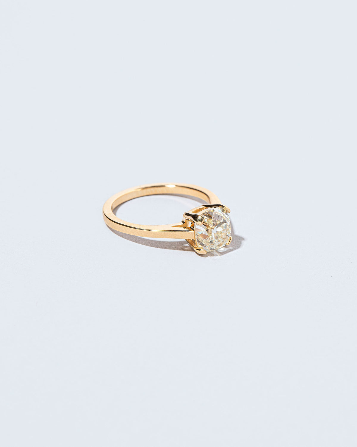 View from the side of the Ichor Ring on light color background.
