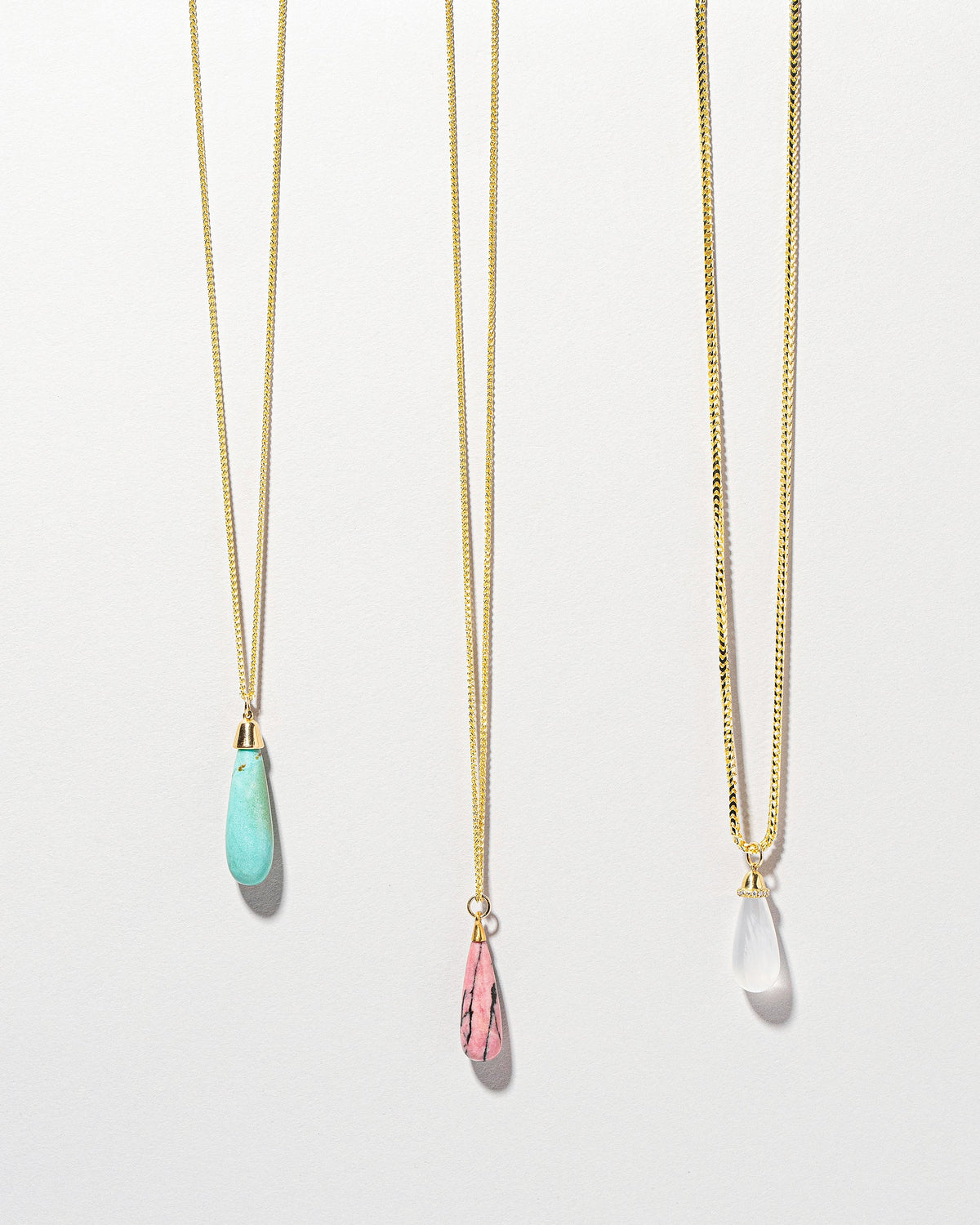  Rhodolite Drop Pendant on light color background.
