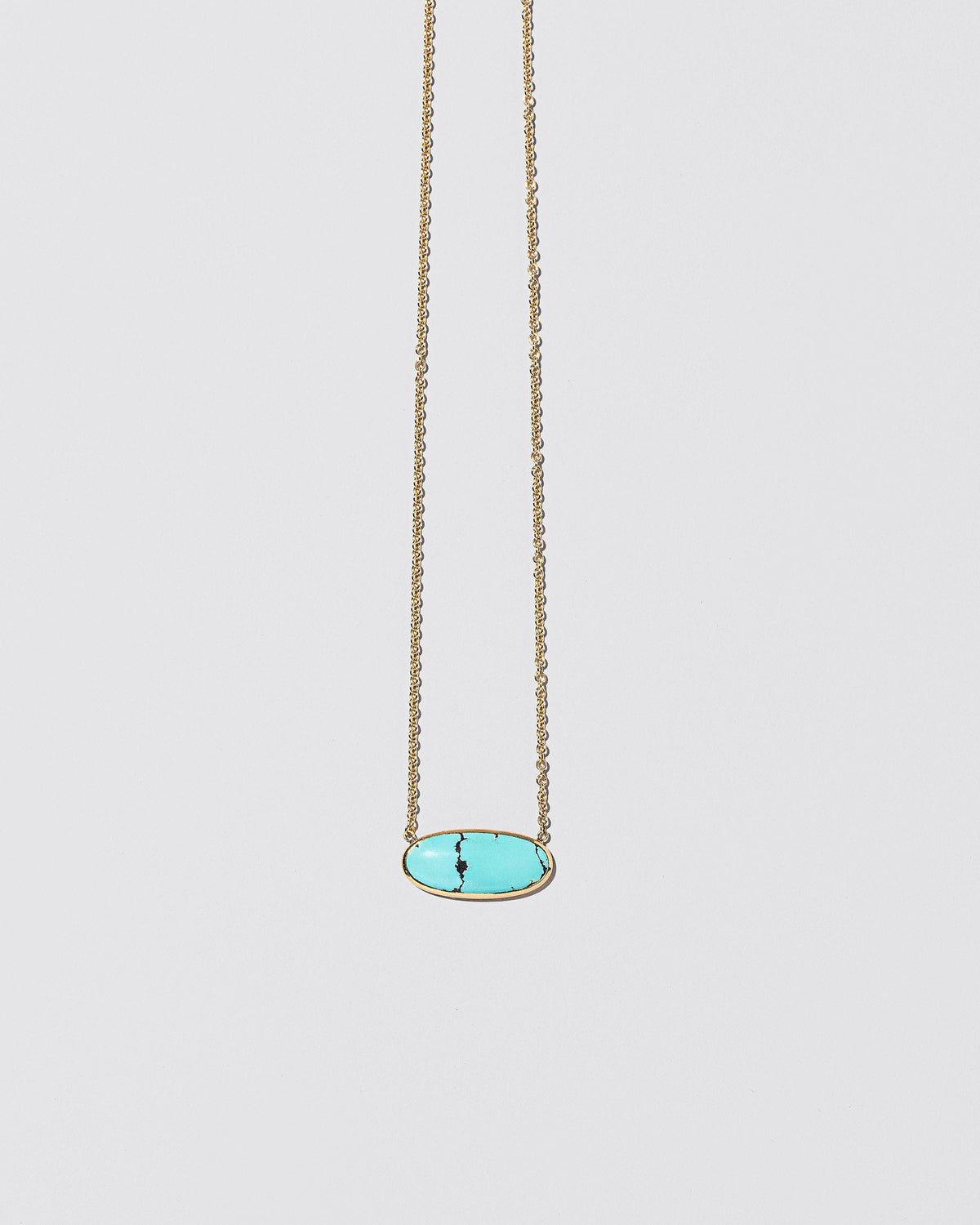 Waters Necklace on light color background.