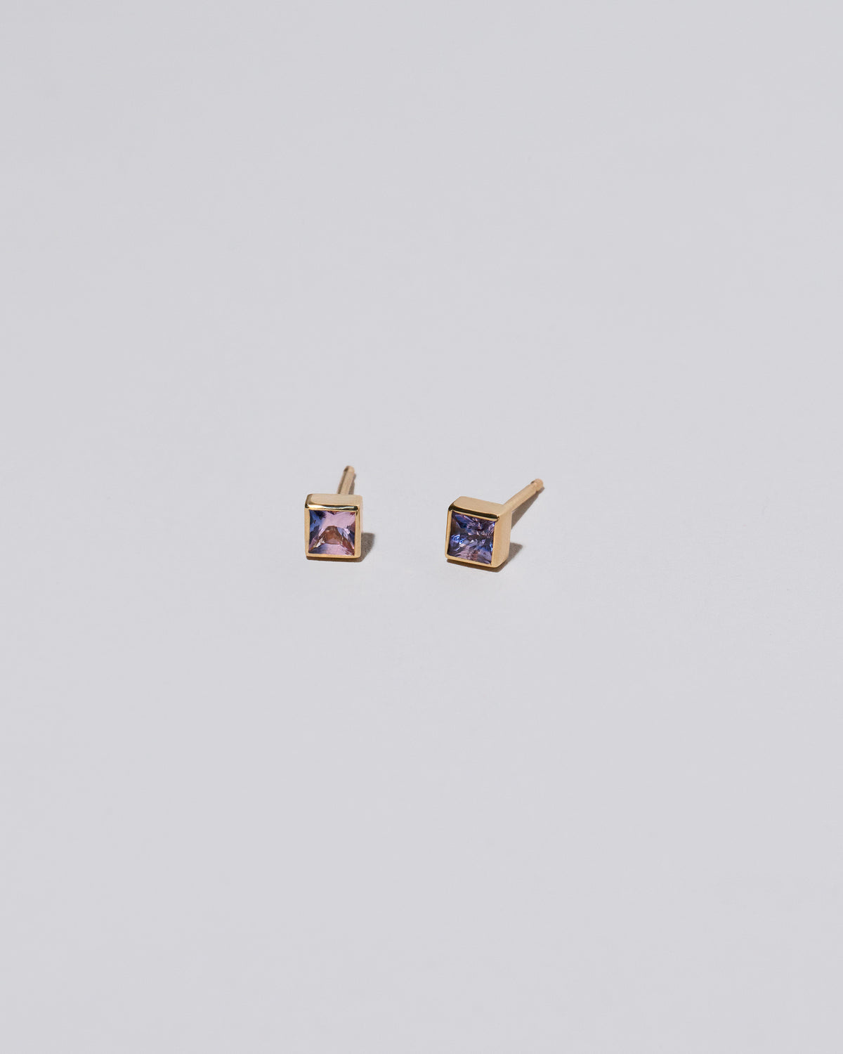 Square Stud - Pink Purple Sapphire on light color background.