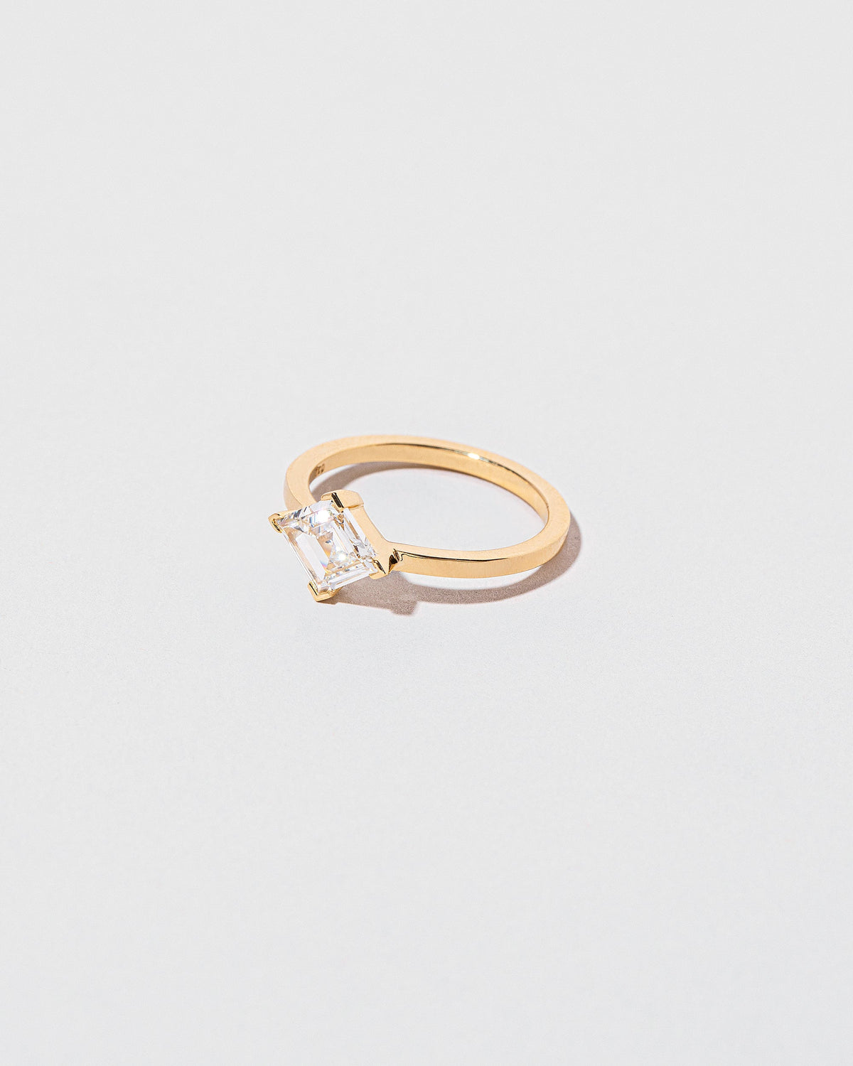 View from the side of the Paradox Ring on light color background.