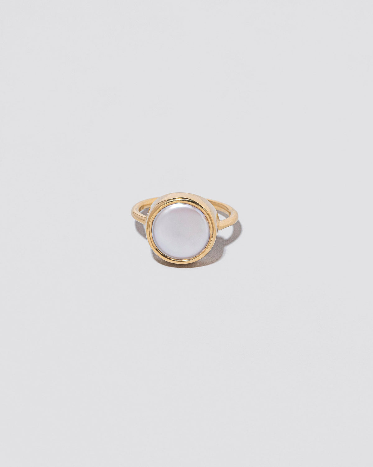 Atlas Ring on light color background.