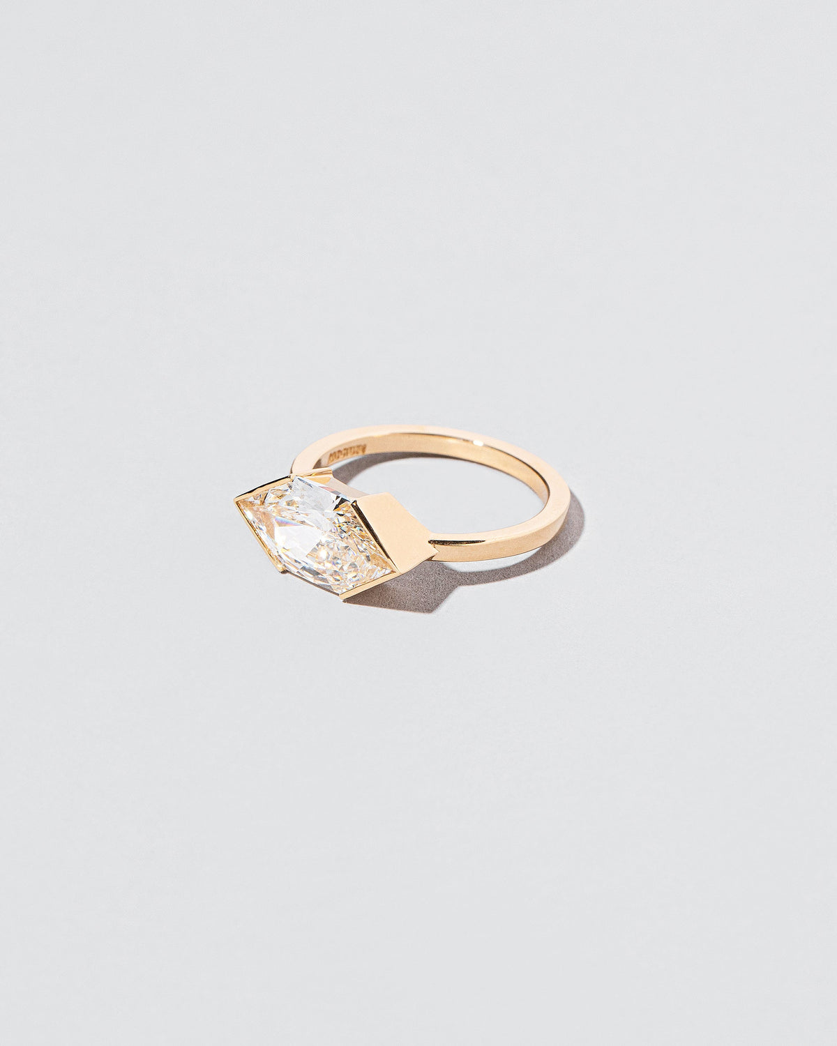 View from the side of the Vertex Ring on light color background.