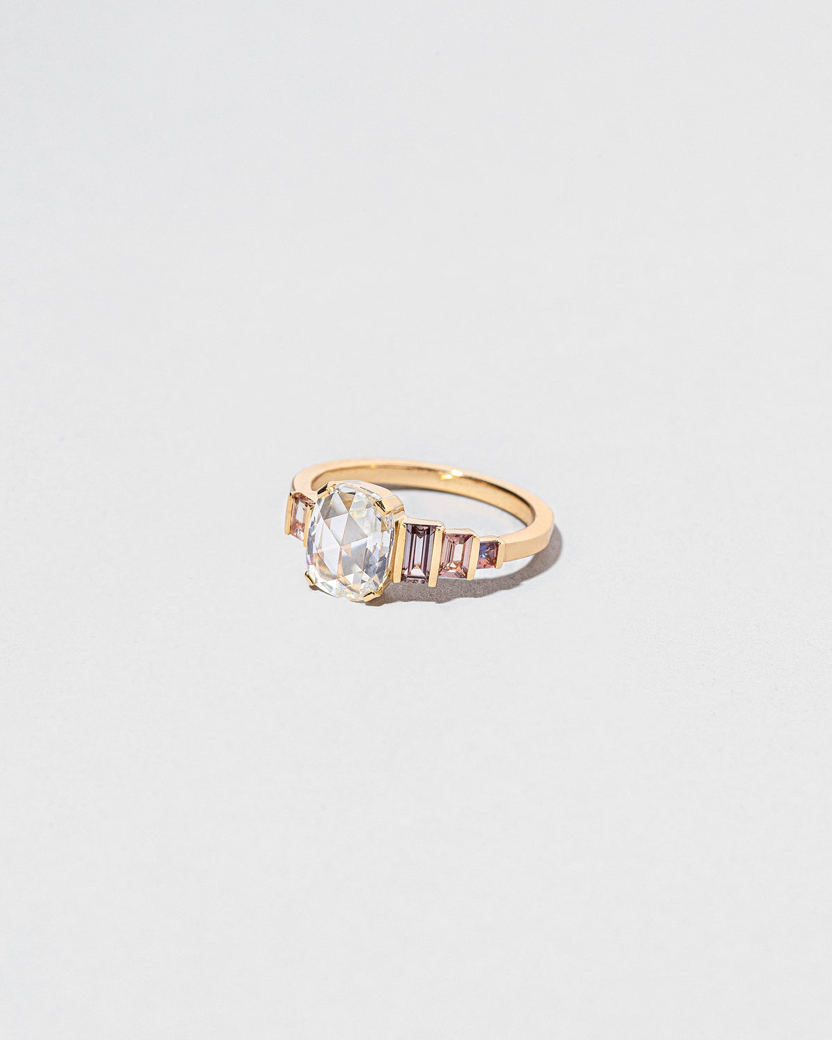  One & The Others Ring on light color background.