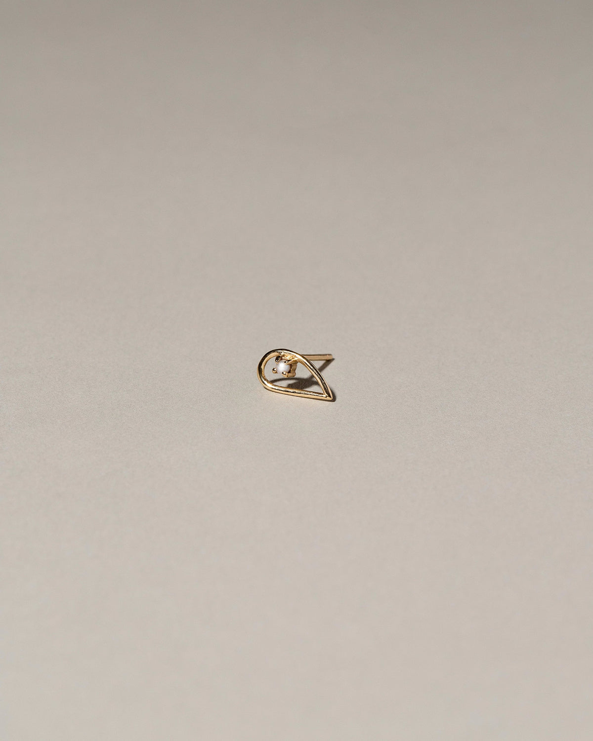  Sun Drop Single Stud on light color background.