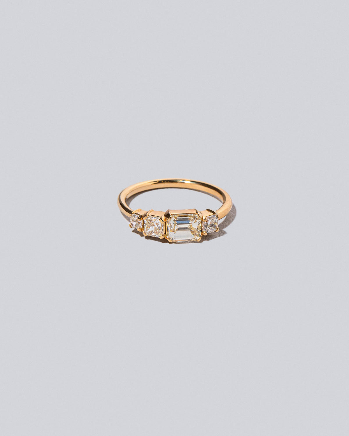 Product photo of the Lyric Ring on light light color background.