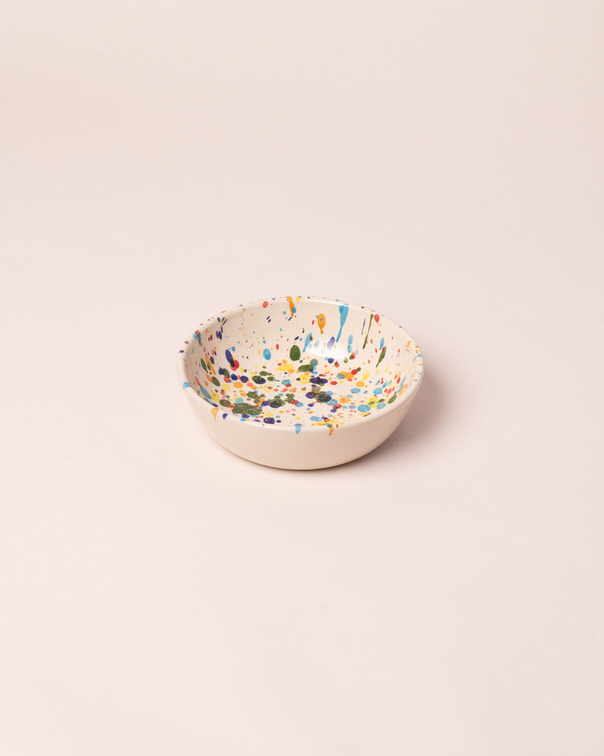 La Ceramica Vincenzo Del Monaco Colored Drops Cereal Bowl on light color background.