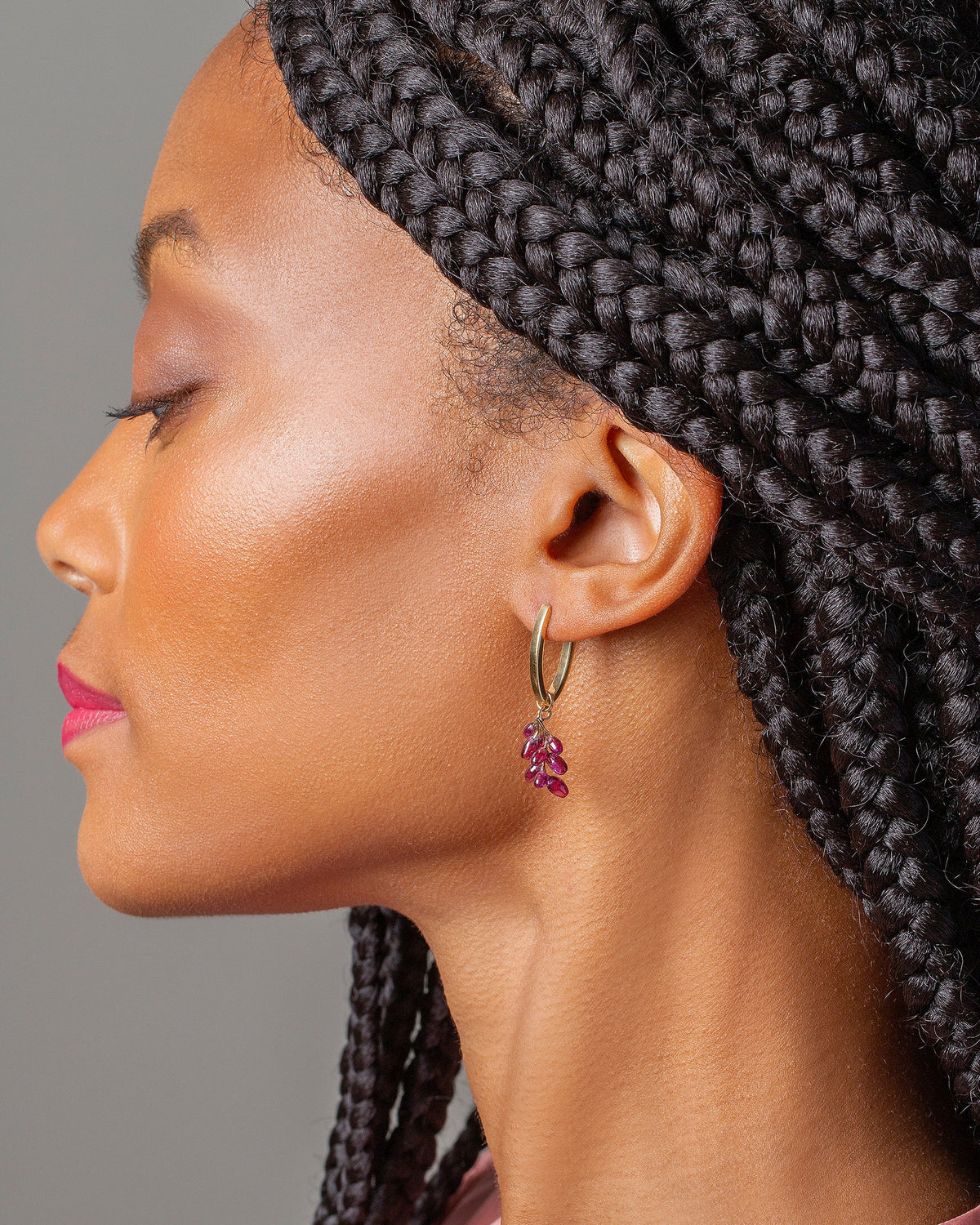 Tiny Loop Hoop with Small Table Grapes Charm on model.