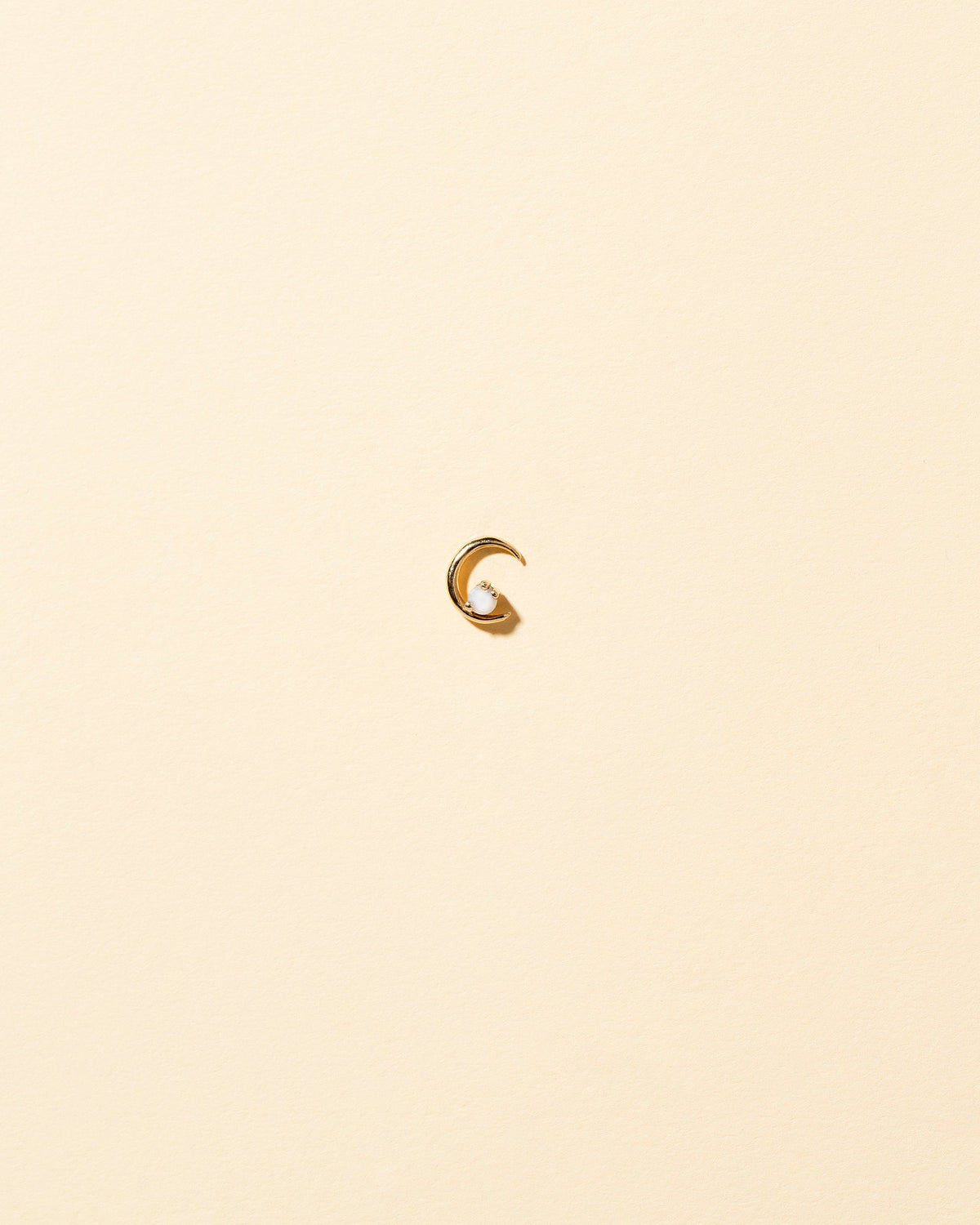 Right Opal Moon Ray Stud Earring Single on light color background.